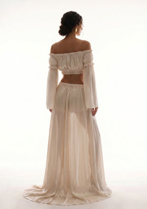 Sirocco cream satin-chiffon maxi skirt back view worn on-model showing the floor-sweeping train and bell sleeves
