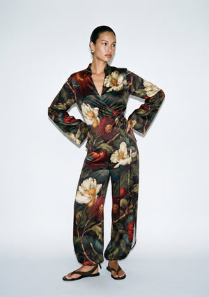 Front view of the Eden silk set, wrap top tied at the side waist with wide-leg trousers gathered softly at the ankle