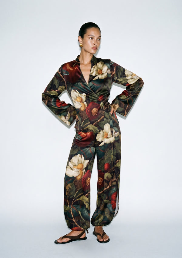 Front view of the Eden silk set, wrap top tied at the side waist with wide-leg trousers gathered softly at the ankle