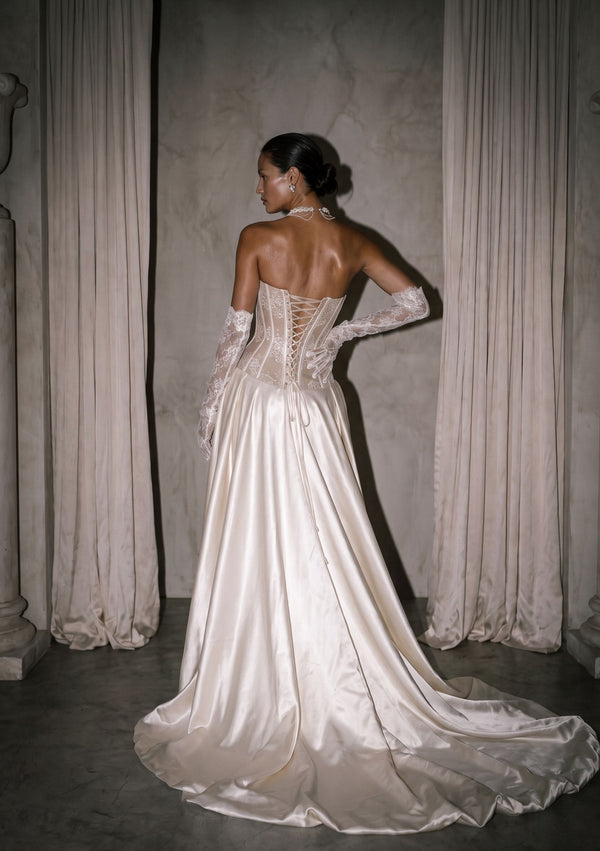Anthurium Dress back view: crossed lace-up corset back and milk satin train