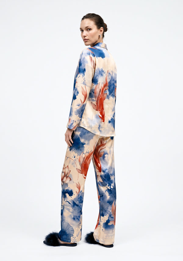 Sumi Set back view on model, printed satin shirt and wide-leg trousers showing the koi and lotus motif across the back
