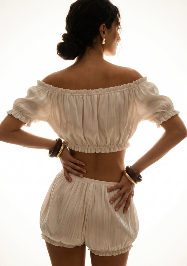 Sirocco cream satin-chiffon bloomer shorts back view worn on-model with the matching crop top and bell sleeves