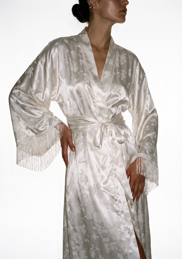 Moonveil robe worn open, the sash loose and the fringed sleeves framing the front opening