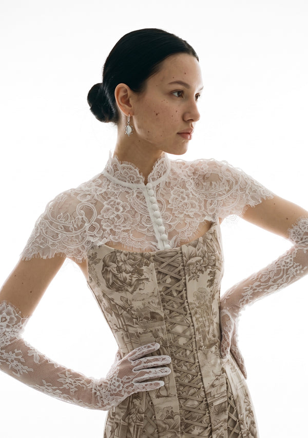 Etherea white lace opera gloves worn with the matching Etherea lace cape and a pearl-button high collar over the Lucentia corset dress