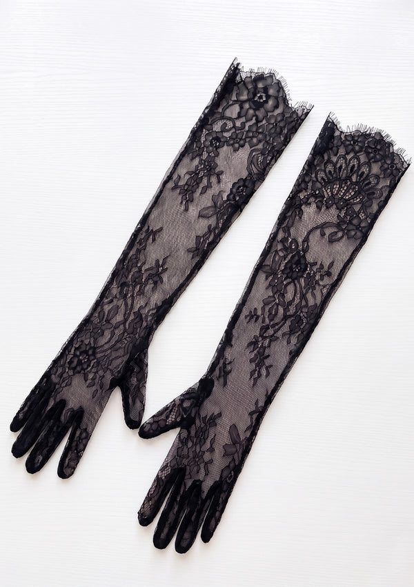 Eclipse black floral lace opera gloves, product-only flat lay showing sheer lace, fingered design and scalloped ruffle trim at the top opening