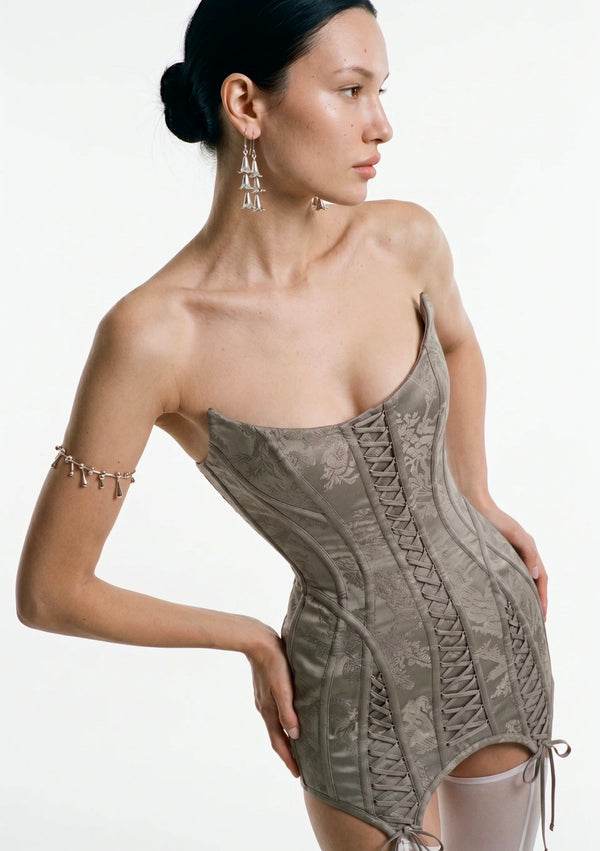 Side bodice detail of the Lucentia dress showing contoured boning and side lace-up