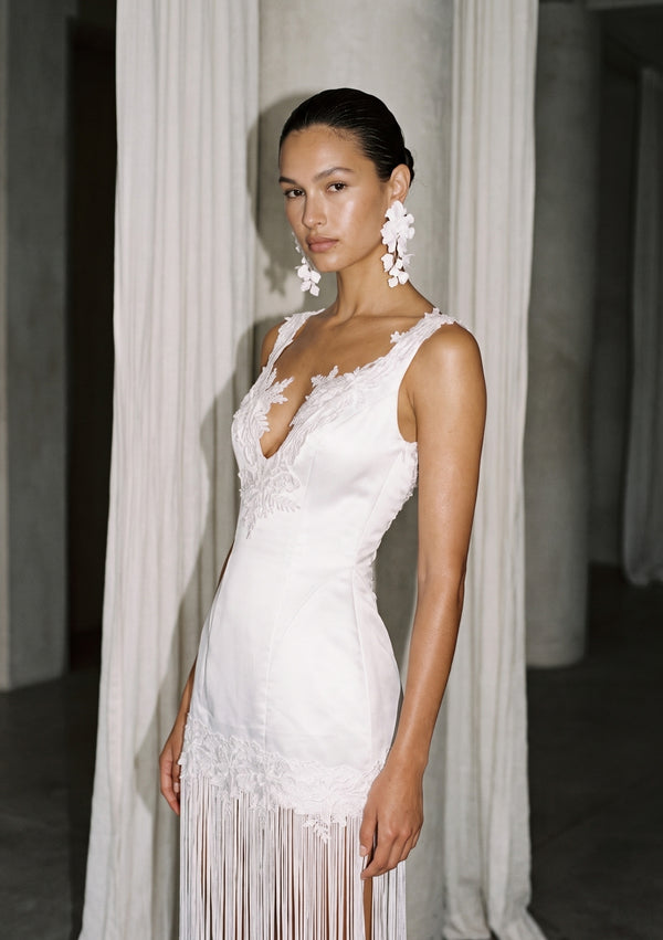 Lily fringe bridal dress, full-length front view: white satin V-neck mini with long fringe to the floor