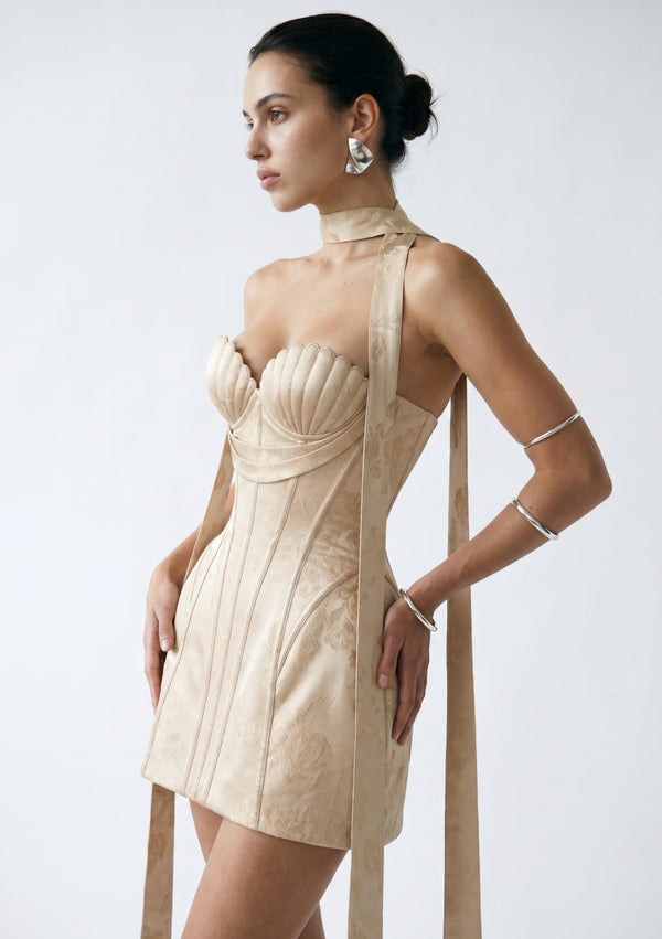 Nacre champagne jacquard corset mini dress side view with flowing ribbons
