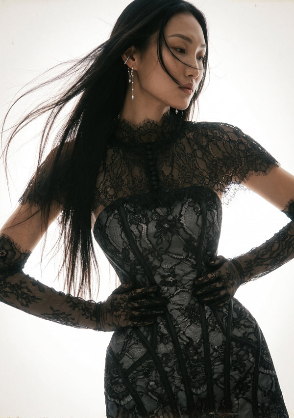 Eclipse Cape worn over a lace-up corset with matching lace gloves, dramatic angled front view
