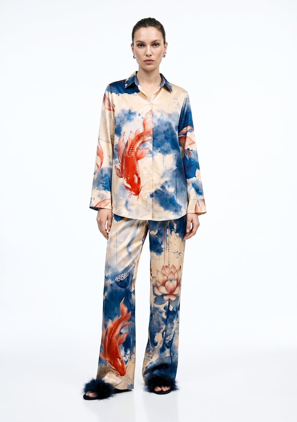 Sumi Set, cream satin pajama set with blue ink-wash koi and lotus print, front view on model with button-down shirt and wide-leg trousers