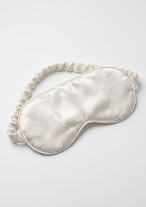 Moonveil padded eye mask with ruffled trim in ivory woven floral jacquard