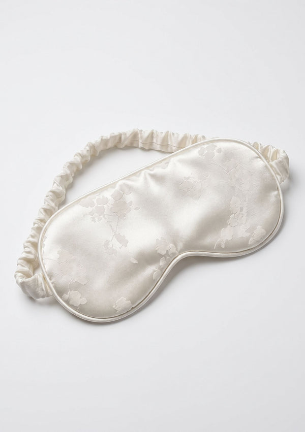 Moonveil padded eye mask with ruffled trim in ivory woven floral jacquard