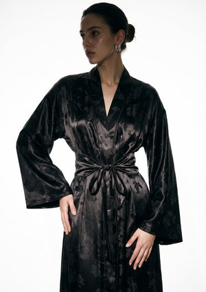 Upper body view of the Tenebrae robe, the collar crossing into a deep V above the belt, sleeves wide at the cuff