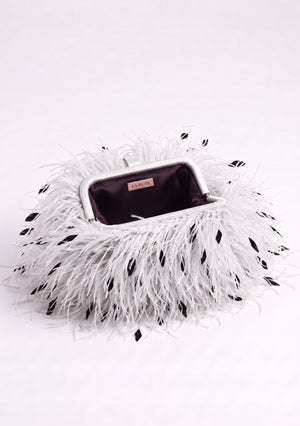 White Feather Bag open: white ostrich feather clutch with black flecks, silver-tone frame and plum lining.