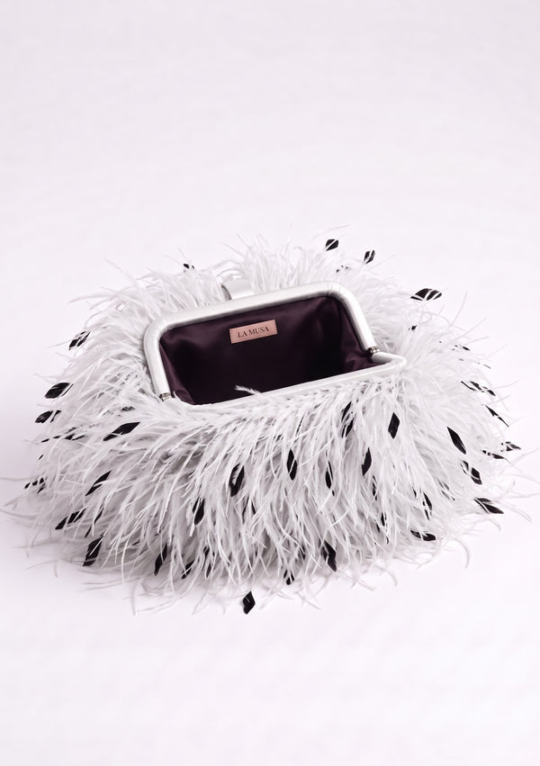 White Feather Bag open: white ostrich feather clutch with black flecks, silver-tone frame and plum lining.
