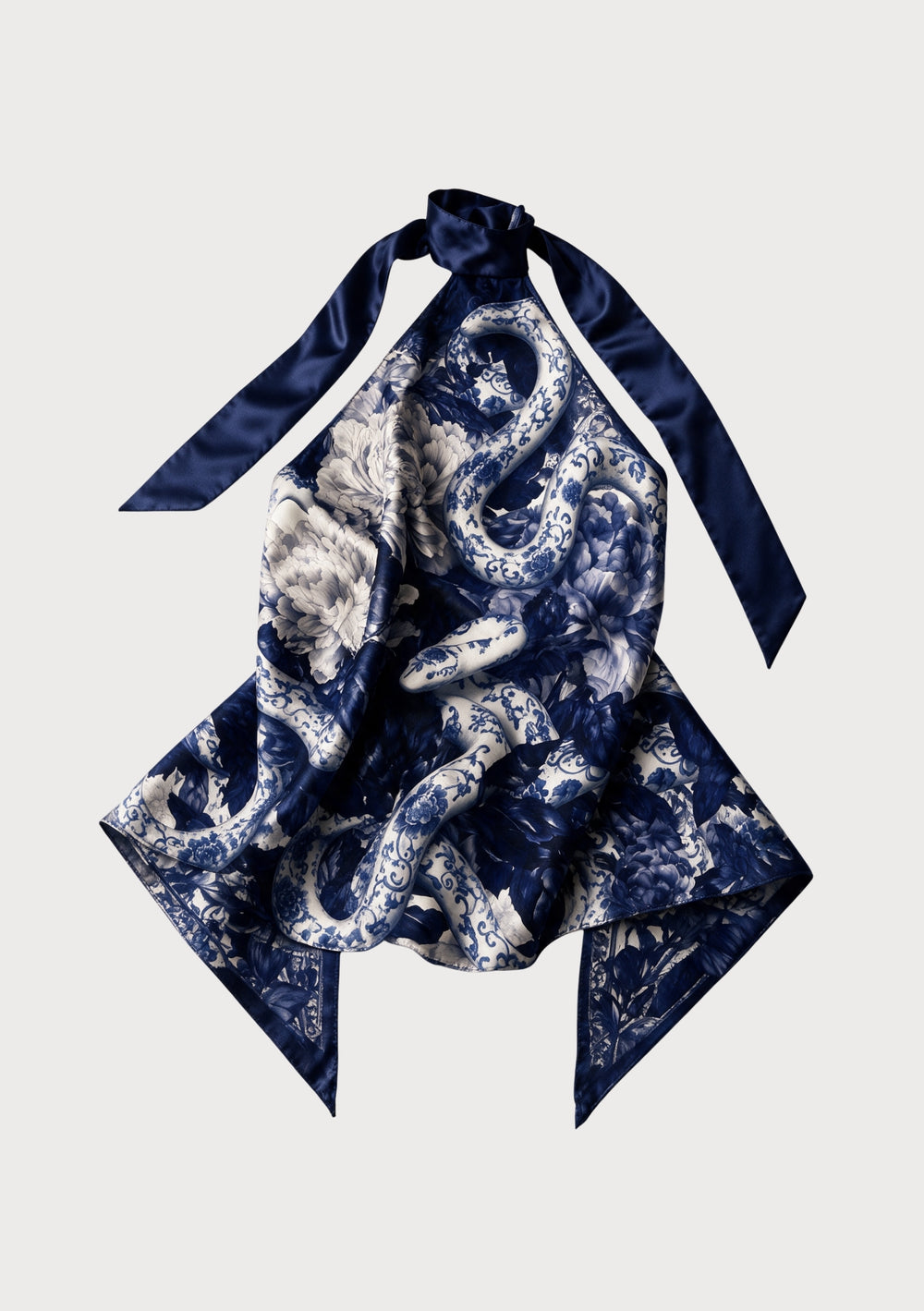 Mirage Peony top worn untucked, the pointed hem hanging loose and one navy tie falling down the centre front