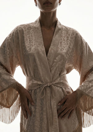 Close front view of the Feline robe, the tonal leopard weave across the collar and the sash tied at the waist