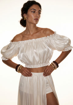 Sirocco cream off-shoulder puff-sleeve crop top front view worn on-model with the matching maxi skirt