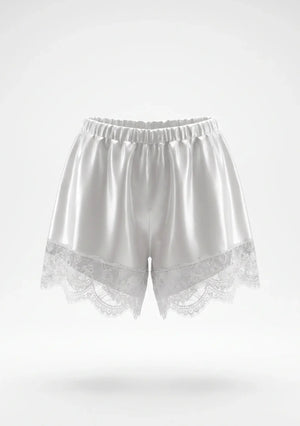 White satin shorts product shot showing elastic gathered waistband and wide scalloped floral lace hem