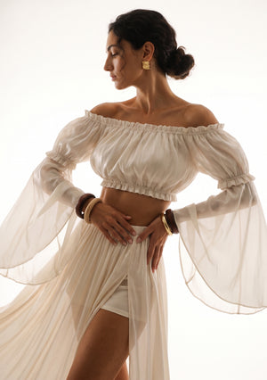 Sirocco cream off-shoulder crop top front view worn on-model with the detachable Sirocco sleeves and the matching maxi skirt