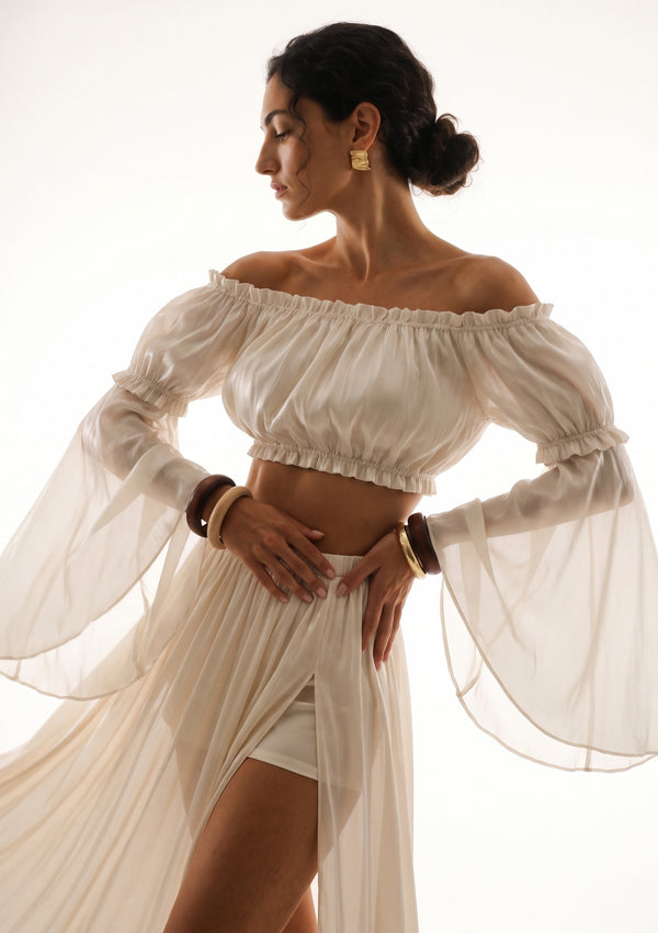 Sirocco cream off-shoulder crop top front view worn on-model with the detachable Sirocco sleeves and the matching maxi skirt