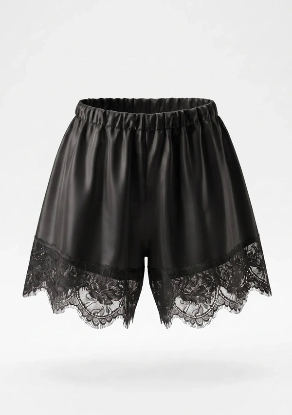 Black satin shorts product shot showing elastic gathered waistband and wide scalloped floral lace hem