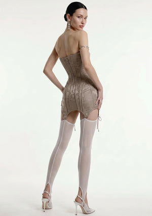 Full-length view of the grey jacquard Lucentia corset mini dress styled with sheer stockings and heels