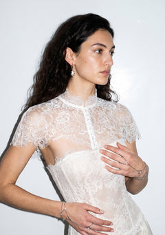 Etherea floral lace capelet with high collar and covered-button front, worn over a matching lace corset bodice