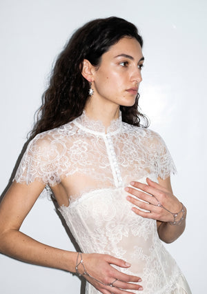 Etherea floral lace capelet with high collar and covered-button front, worn over a matching lace corset bodice