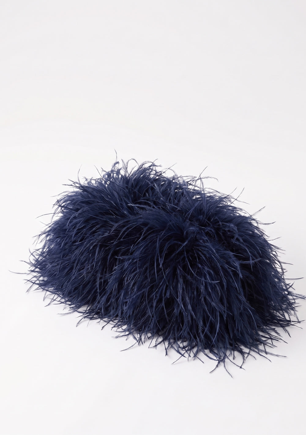 Ocean Feather Bag closed, a deep navy ostrich feather clutch, front view.