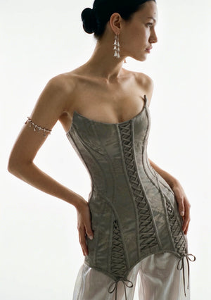 Side view of the grey jacquard Lucentia corset mini dress with sculptural boning and lace-up panels