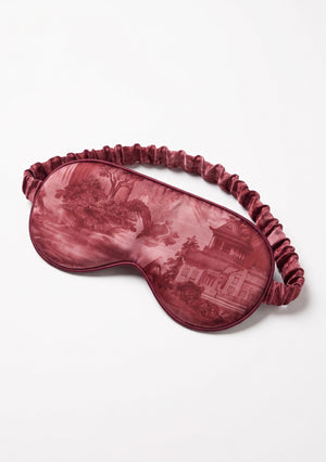 Crimson Dusk padded eye mask with a ruffled elastic strap in deep burgundy landscape print with pagodas and mountains