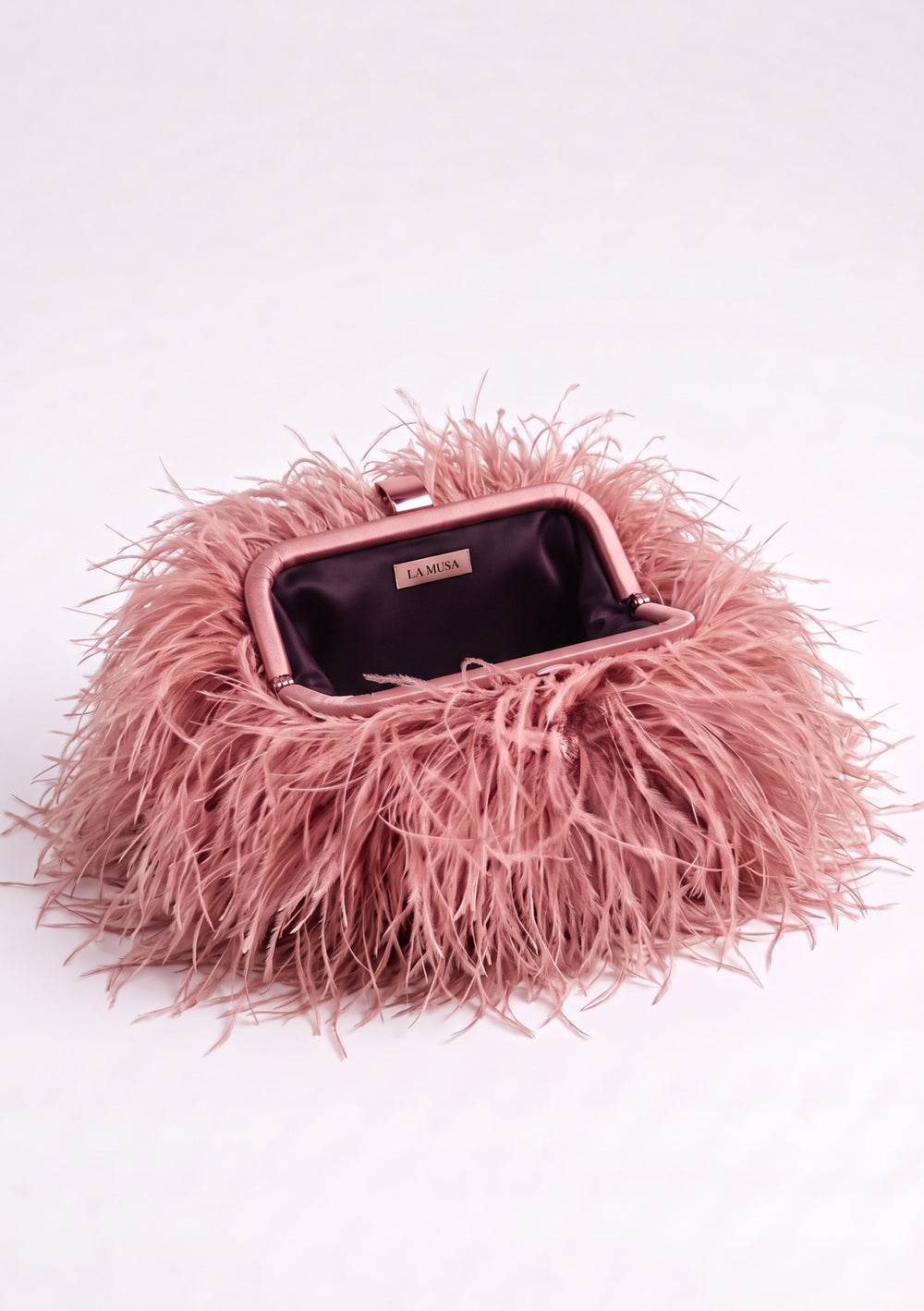 Peach Feather Bag, a dusty pink ostrich feather clutch, side view.
