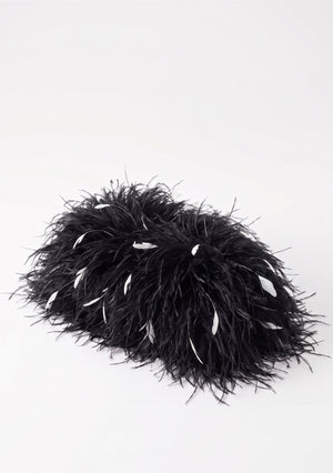 Black Feather Bag, an ostrich feather clutch in black with scattered white feathers, top view.