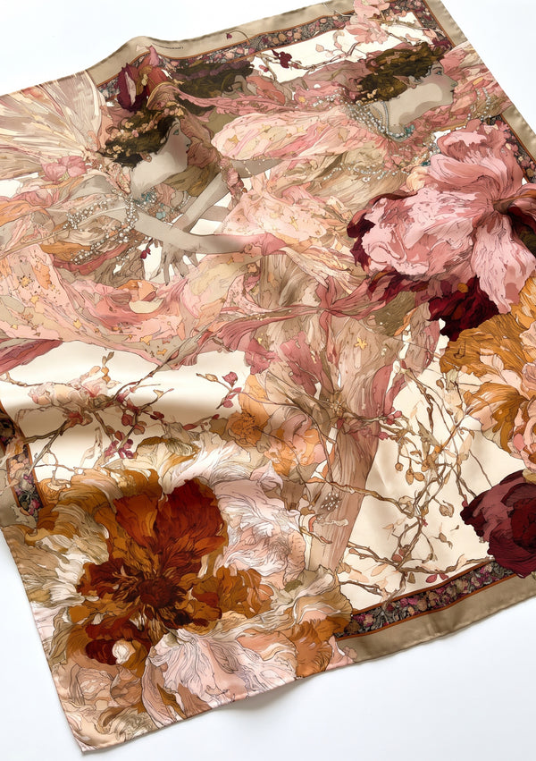 Angled flat view of the Nimue silk scarf showing the full print, the pearl-strung muses and the ornamental taupe border