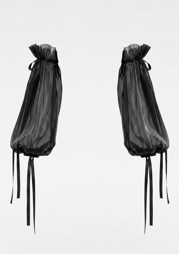 The Eclipse sleeves shown as a pair without a model, sheer black organza gathered at both ends with long satin ribbon ties