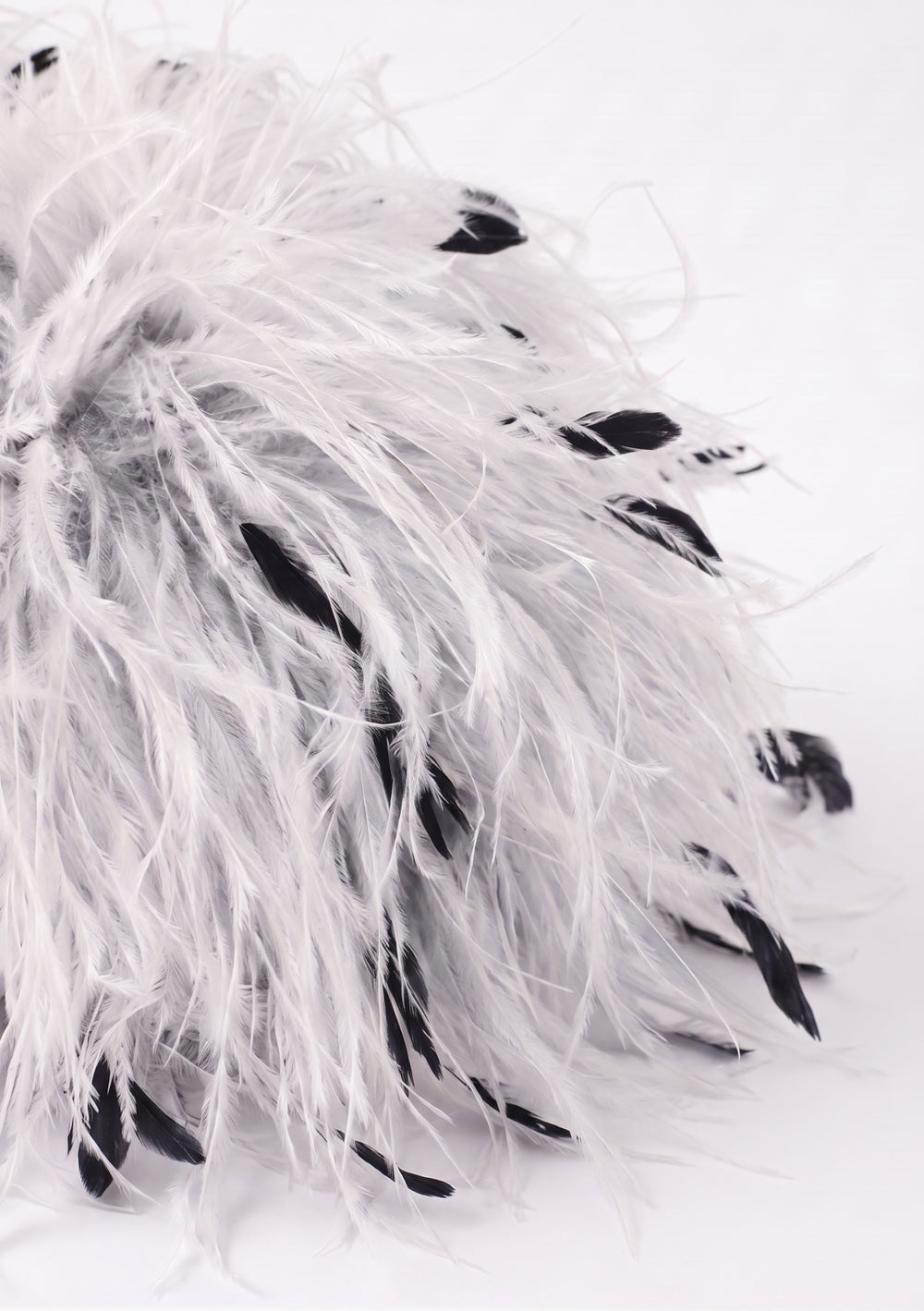 White Feather Bag open: white ostrich feather clutch with black flecks, silver-tone frame and plum lining.