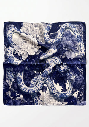 Mirage Peony Scarf laid flat, large square silk scarf with cobalt blue porcelain serpents, white peonies and an ornamental border