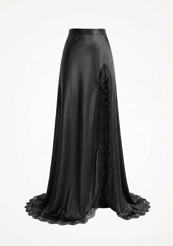La Musa Midnight Skirt product shot: black satin maxi skirt with an asymmetric thigh-high slit edged in scalloped lace and corset ribbon-lacing, with a lace-trimmed hem