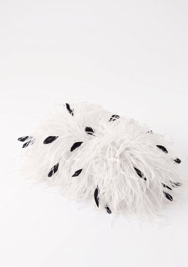 White Feather Bag closed, side view, white ostrich feathers with scattered black ones.