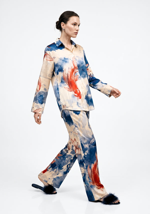 Sumi Set side view on a walking model, printed satin shirt with wide-leg palazzo trousers in motion