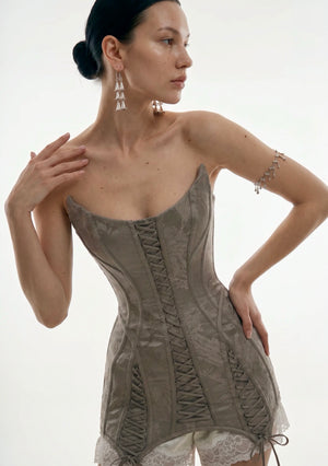 Front close-up of the Lucentia dress centre and side lace-up panels on the jacquard bodice