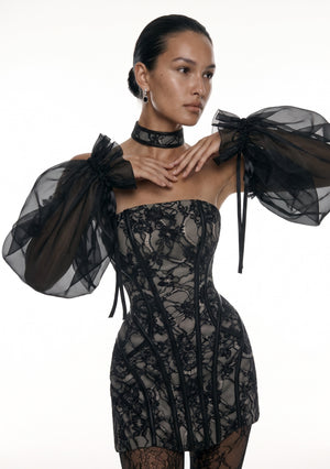 Eclipse sleeves lifted to show the full bishop volume of the sheer organza and the ribbon ties at each shoulder