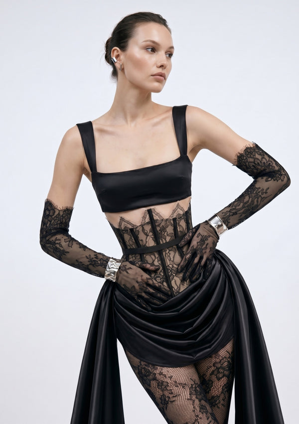 Model wears the black satin Baccara Top with the sheer lace Baccara corset skirt and lace gloves