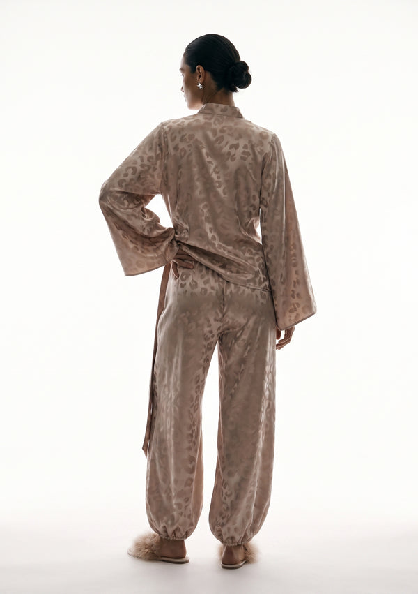 Back view of the Feline set, the leopard jacquard running across the shirt and down the full length of the trousers