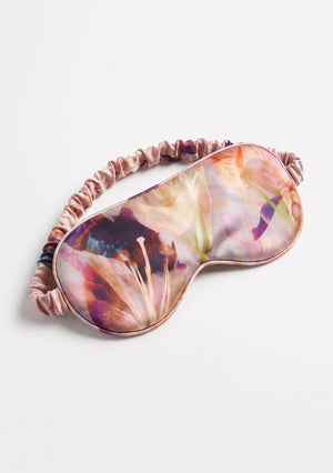 Opalia padded eye mask with a ruffled elastic strap in watercolor floral print in pink, ivory and deep violet
