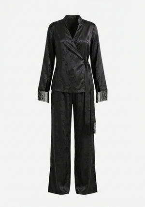 Tenebrae Set flat lay on white, black jacquard wrap top with long fringed sash and matching wide-leg trousers with side hem slits