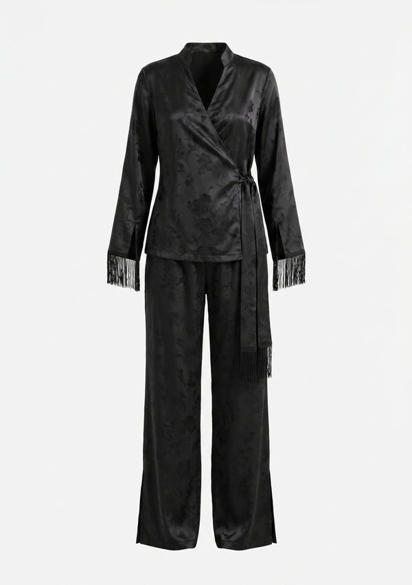 Tenebrae Set flat lay on white, black jacquard wrap top with long fringed sash and matching wide-leg trousers with side hem slits