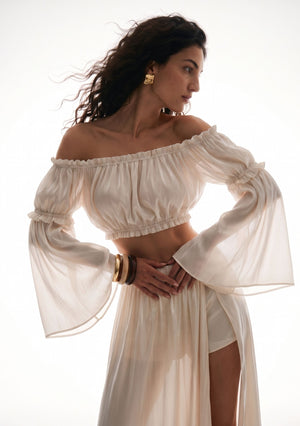 Sirocco cream sheer flared sleeves worn with the matching Sirocco top and skirt