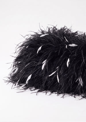 Side view of the Black Feather Bag in black ostrich feathers with white flecks.